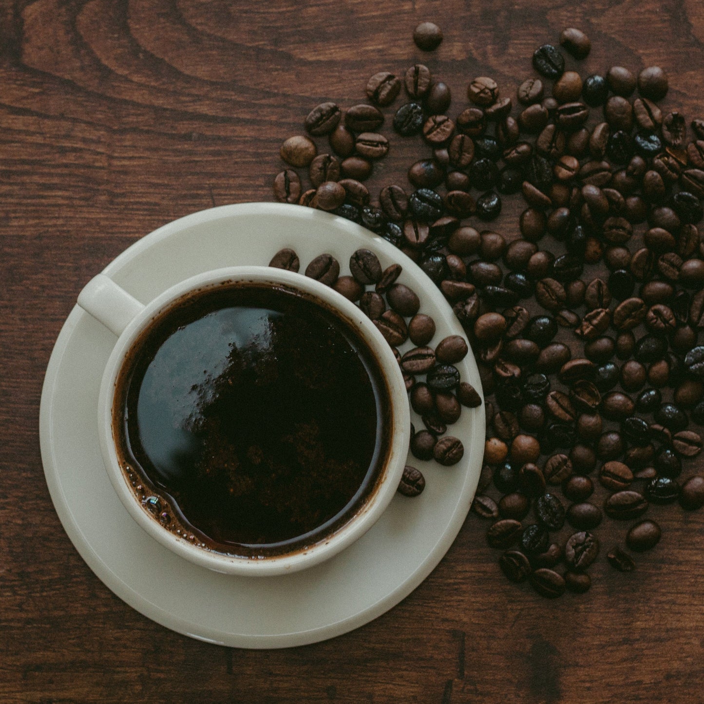 Cup of coffee and coffee beans